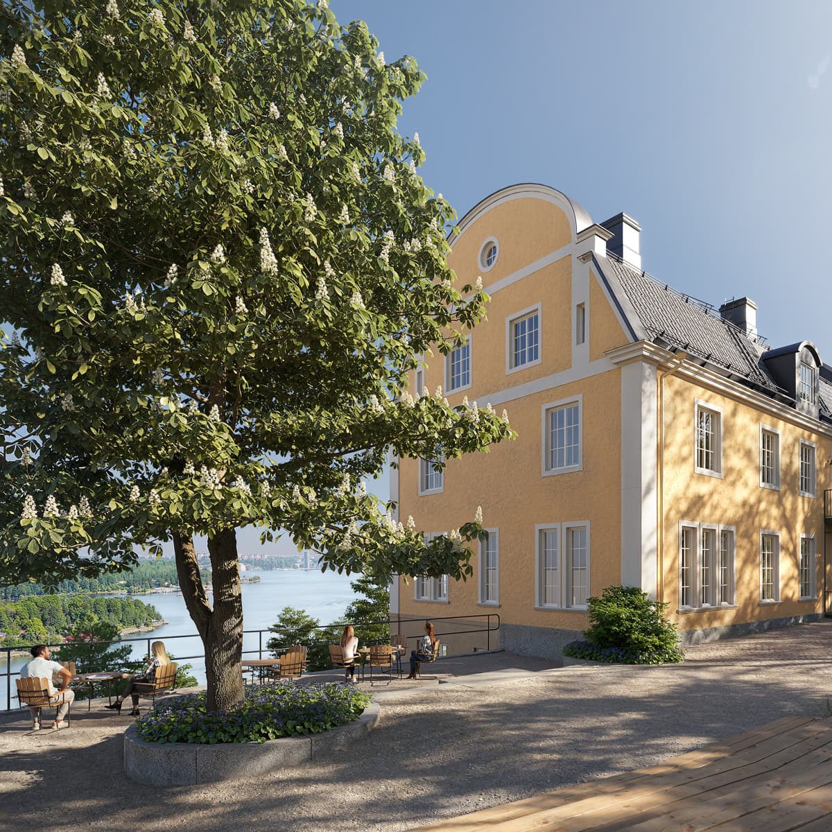 Ett stort gult hus som ligger på toppen av en grönskande sluttning.